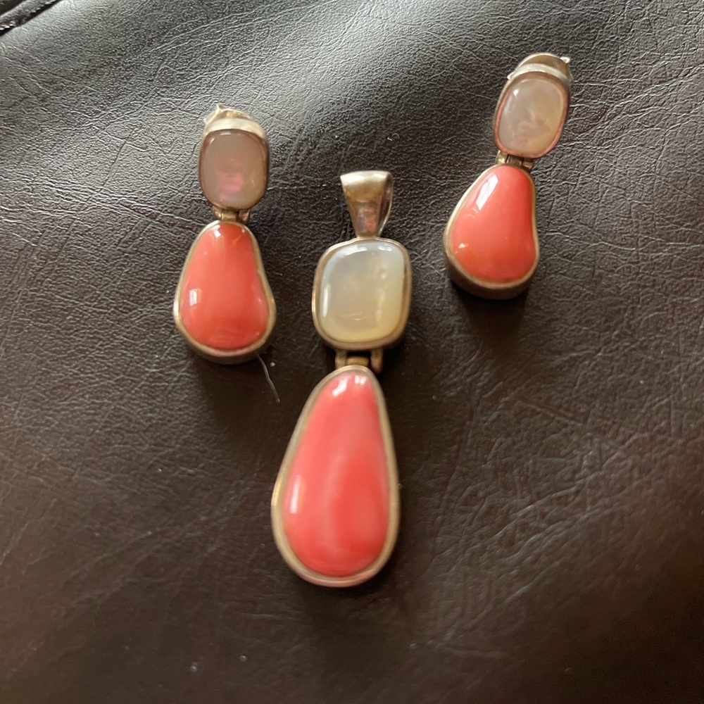 Coral and moonstone sterling silver earring and pendant set.